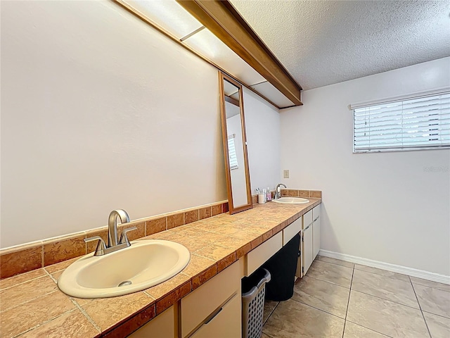 1007 Gammage Pt, Oviedo, FL 32765 - bathroom featuring double vanity, a textured ceiling, and tile patterned floors