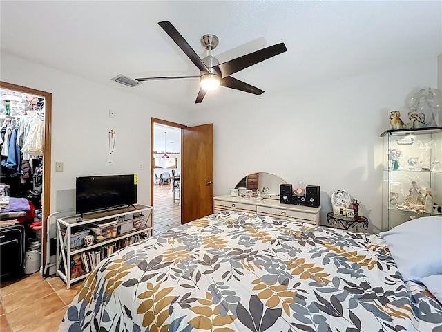 1007 Gammage Pt, Oviedo, FL 32765 - bedroom featuring light tile patterned flooring and a ceiling fan