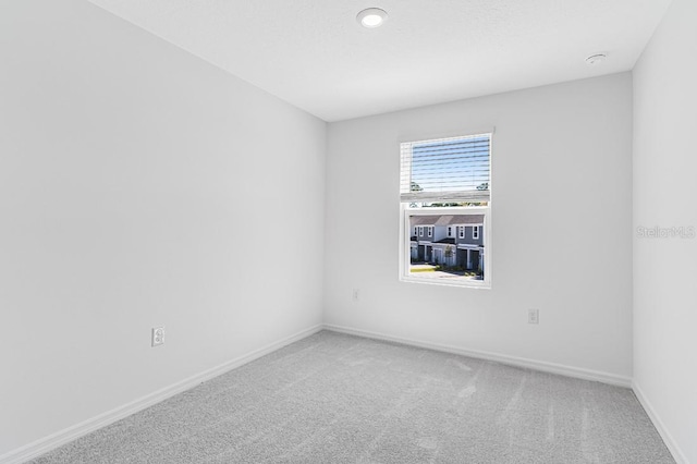 172 River Front Way, Edgewater, FL 32141 - spare room featuring baseboards and light colored carpet