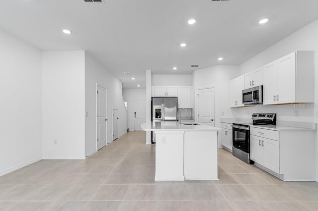 172 River Front Way, Edgewater, FL 32141 - kitchen featuring a sink, appliances with stainless steel finishes, a kitchen island with sink, and recessed lighting