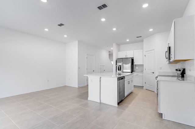 172 River Front Way, Edgewater, FL 32141 - kitchen featuring visible vents, a center island with sink, a sink, light countertops, and stainless steel appliances