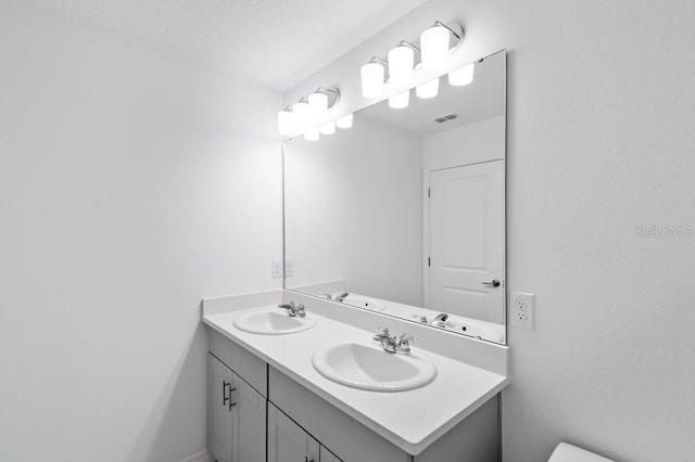 174 River Front Way, Edgewater, FL 32141 - bathroom with a sink, double vanity, and visible vents