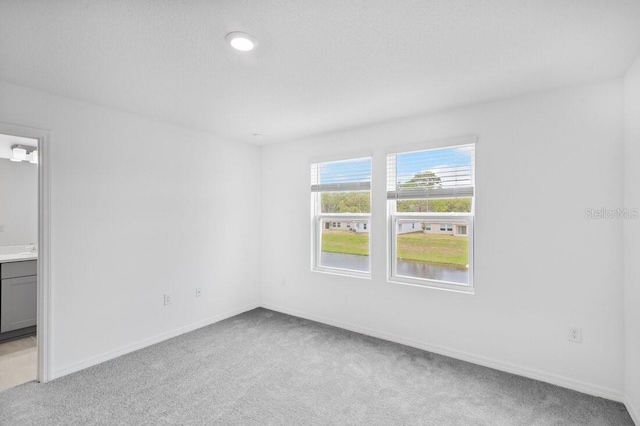 174 River Front Way, Edgewater, FL 32141 - unfurnished room featuring baseboards and light colored carpet