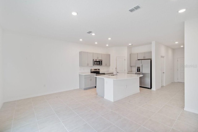 174 River Front Way, Edgewater, FL 32141 - kitchen featuring light countertops, gray cabinets, stainless steel appliances, and visible vents