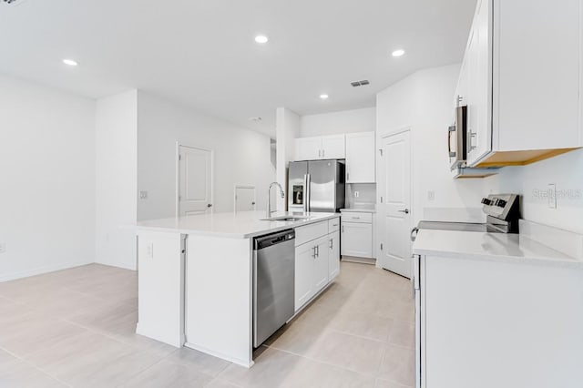 176 River Front Way, Edgewater, FL 32141 - kitchen with visible vents, a kitchen island with sink, white cabinetry, a sink, and stainless steel appliances