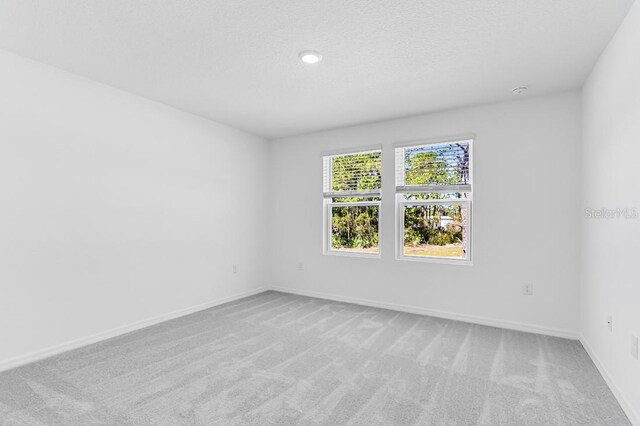 176 River Front Way, Edgewater, FL 32141 - unfurnished room featuring baseboards and light carpet