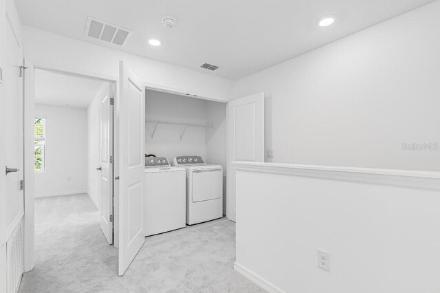 176 River Front Way, Edgewater, FL 32141 - laundry room featuring laundry area, light colored carpet, independent washer and dryer, and visible vents