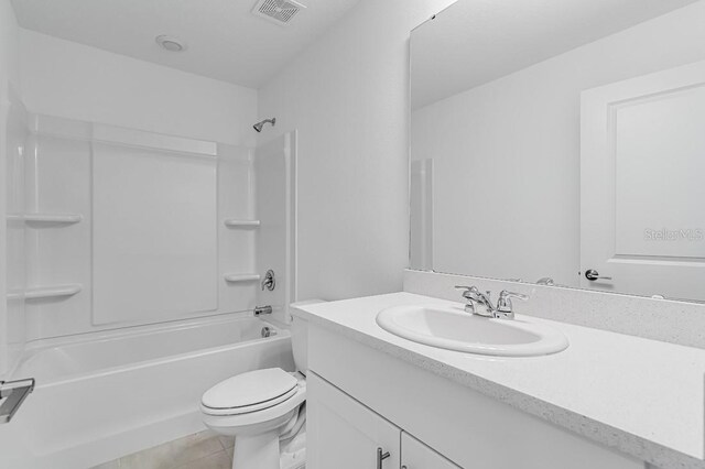 176 River Front Way, Edgewater, FL 32141 - full bathroom with visible vents, vanity, toilet, bathtub / shower combination, and tile patterned floors