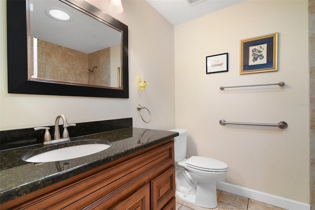 1034 Weathered Wood Cir, Winter Springs, FL 32708 - full bathroom with tile patterned flooring, toilet, vanity, baseboards, and tiled shower