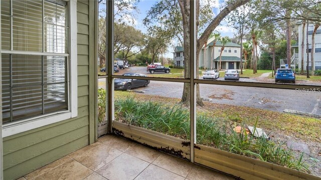 5962 Westgate Dr Unit 101, Orlando, FL 32835 - unfurnished sunroom featuring a residential view