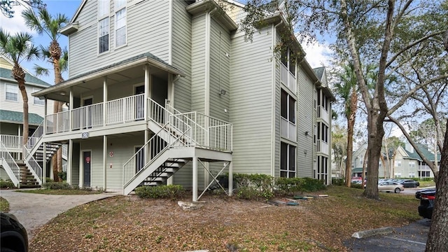 5962 Westgate Dr Unit 101, Orlando, FL 32835 - view of building exterior featuring stairway