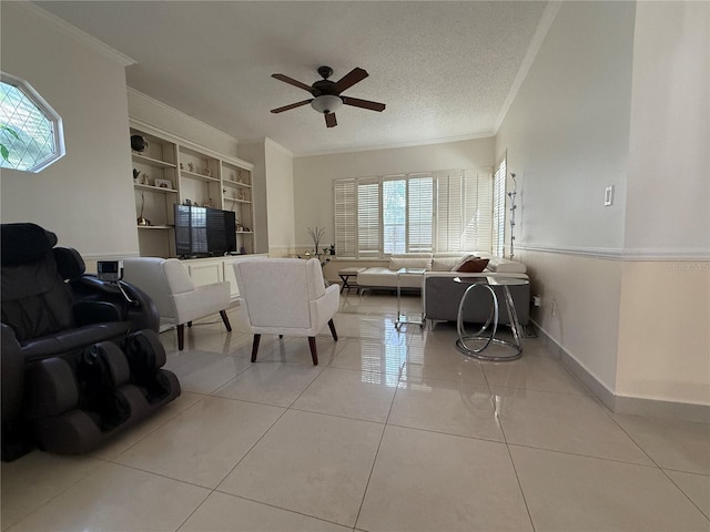 14326 Mandolin Dr, Orlando, FL 32837 - living area featuring light tile patterned floors, baseboards, ornamental molding, ceiling fan, and a textured ceiling