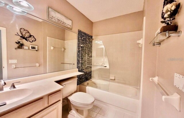 14326 Mandolin Dr, Orlando, FL 32837 - bathroom featuring tile patterned floors, vanity, toilet, and shower / bath combination