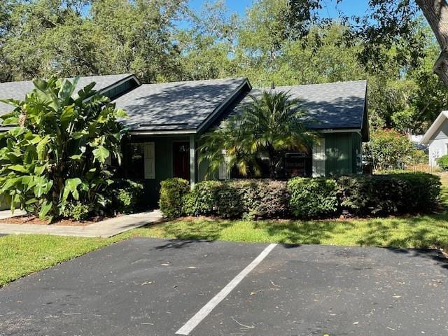 622 Mount Homer Rd Unit 622, Eustis, FL 32726 - view of front of house with roof with shingles and uncovered parking
