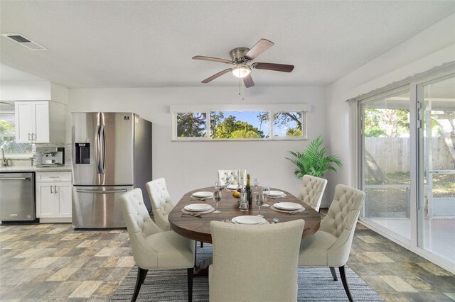 5144 Orange Ave, Winter Park, FL 32792 - dining area featuring stone finish flooring and ceiling fan
