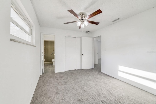 5144 Orange Ave, Winter Park, FL 32792 - unfurnished bedroom with carpet, connected bathroom, visible vents, and a closet