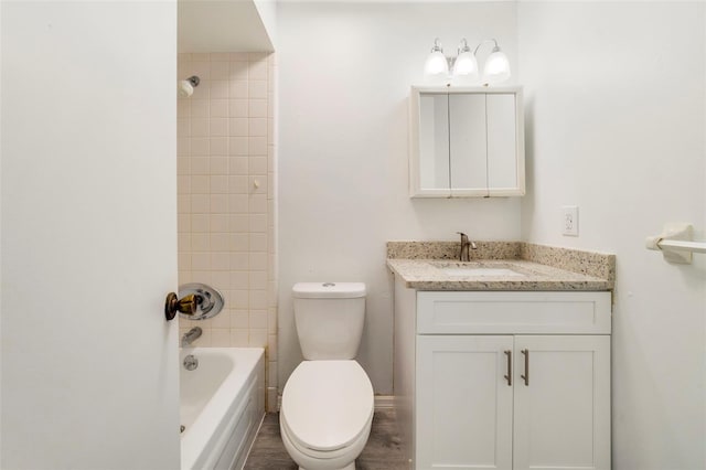 5144 Orange Ave, Winter Park, FL 32792 - full bath featuring toilet, vanity, and washtub / shower combination