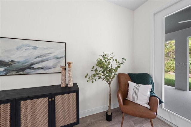 sitting room featuring wood finished floors and baseboards