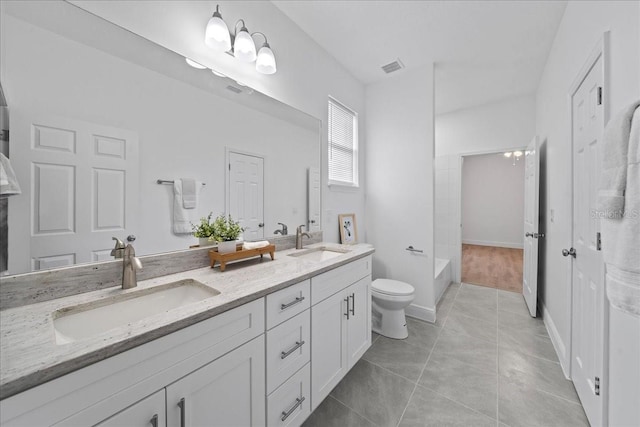 full bathroom with visible vents, a sink, double vanity, and toilet