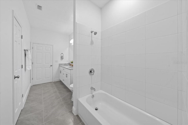 bathroom with washtub / shower combination, tile patterned floors, visible vents, vanity, and baseboards