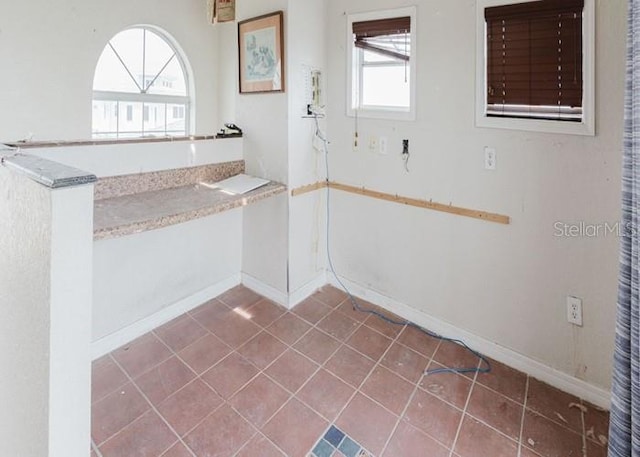 11120 5th St E, Treasure Island, FL 33706 - bathroom featuring tile patterned floors and baseboards
