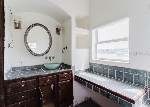 11120 5th St E, Treasure Island, FL 33706 - bathroom with vanity and vaulted ceiling