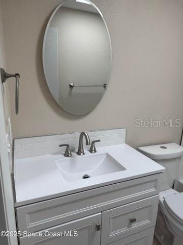 half bath with toilet and vanity