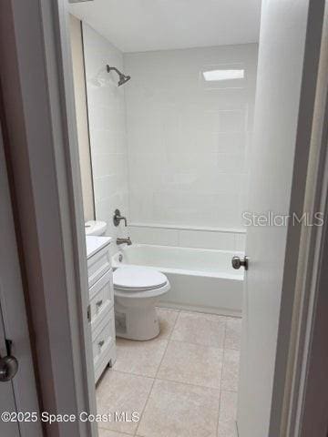 bathroom featuring bathing tub / shower combination, toilet, tile patterned flooring, and vanity