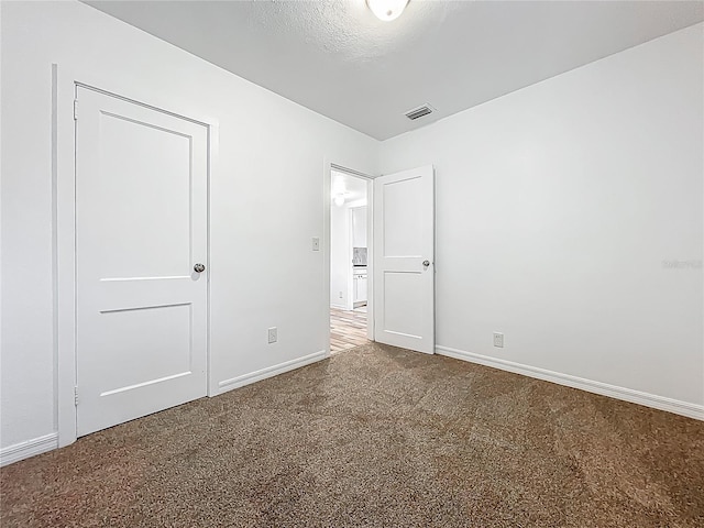 unfurnished bedroom with carpet and baseboards