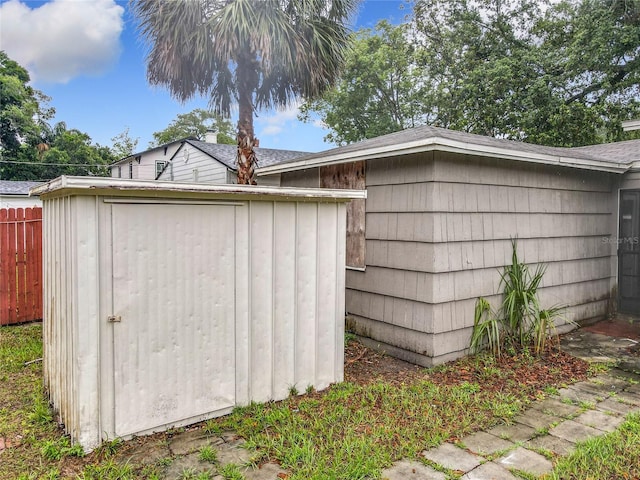 view of shed with fence
