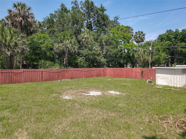view of yard with a storage unit and an outdoor structure