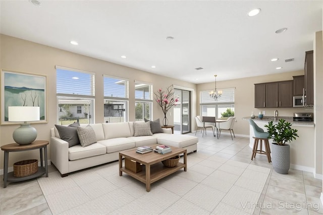 1028 Sadie Ridge Rd, Clermont, FL 34715 - living area with a chandelier, recessed lighting, light tile patterned flooring, and baseboards
