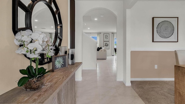 33609 Seattle Slew Dr, Sorrento, FL 32776 - corridor with light tile patterned flooring, baseboards, arched walkways, and recessed lighting