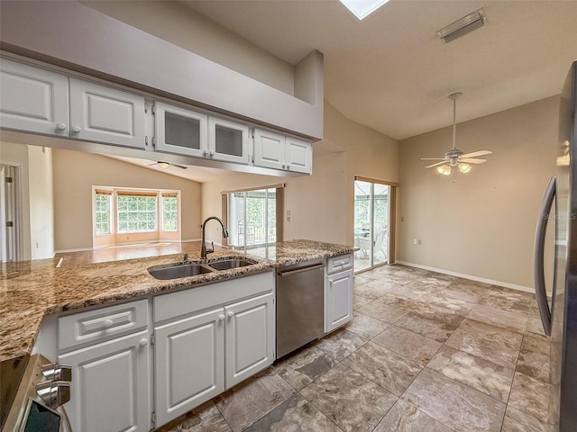 2444 Grandfather Mtn, Spring Hill, FL 34606 - kitchen featuring dishwasher, lofted ceiling, a sink, a ceiling fan, and white cabinetry