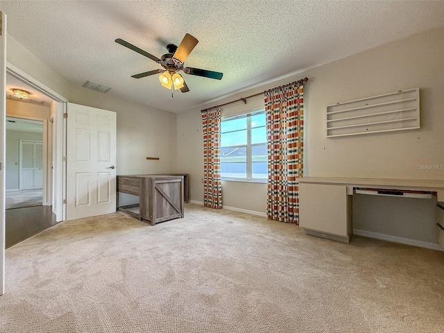 2444 Grandfather Mtn, Spring Hill, FL 34606 - unfurnished bedroom with carpet floors, a textured ceiling, baseboards, a ceiling fan, and an office area