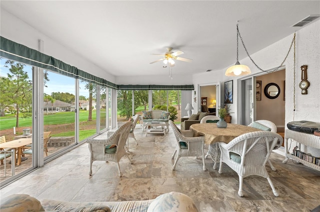 2444 Grandfather Mtn, Spring Hill, FL 34606 - sunroom featuring plenty of natural light, ceiling fan, and an outdoor hangout area