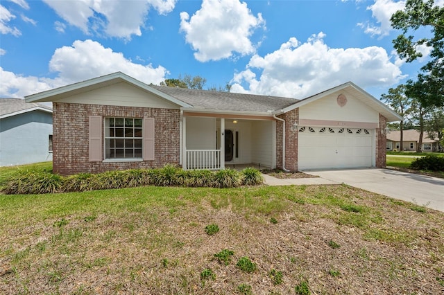 2436 Deer Trail Ln, Spring Hill, FL 34606 - ranch-style home with covered porch, brick siding, a garage, driveway, and a front lawn
