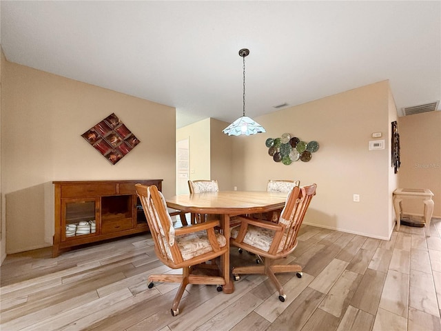 2436 Deer Trail Ln, Spring Hill, FL 34606 - dining room featuring light wood finished floors