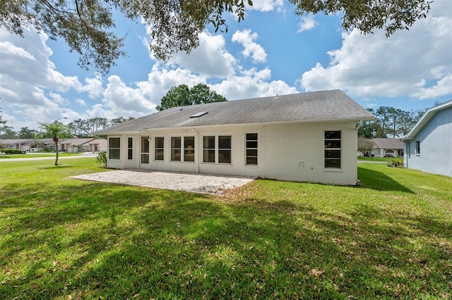 2436 Deer Trail Ln, Spring Hill, FL 34606 - back of property featuring a patio, a yard, and stucco siding