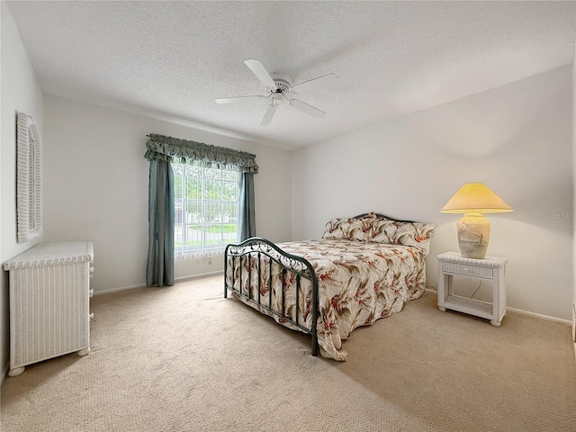 2436 Deer Trail Ln, Spring Hill, FL 34606 - bedroom featuring carpet floors, a textured ceiling, ceiling fan, and baseboards