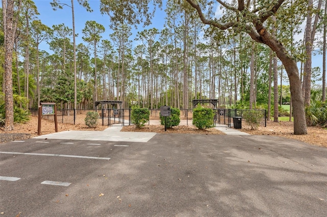 2436 Deer Trail Ln, Spring Hill, FL 34606 - uncovered parking lot with a gate