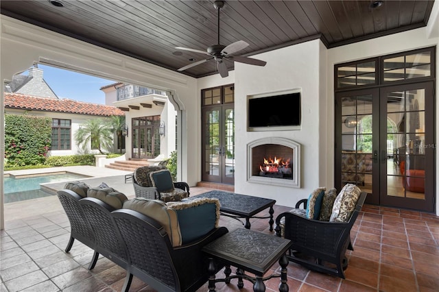 10138 Enchanted Oak Dr, Golden Oak, FL 32836 - view of patio featuring an outdoor pool, french doors, an outdoor living space with a fireplace, and a ceiling fan
