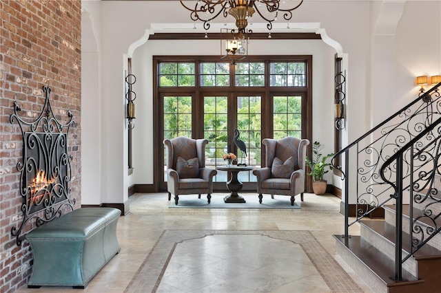 10138 Enchanted Oak Dr, Golden Oak, FL 32836 - interior space featuring a wealth of natural light, stairs, a towering ceiling, and a notable chandelier