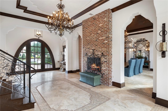 10138 Enchanted Oak Dr, Golden Oak, FL 32836 - entrance foyer with a raised ceiling, arched walkways, baseboards, and stairway
