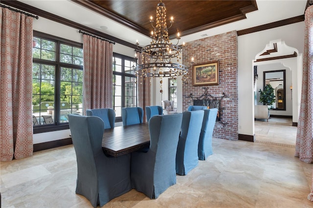 10138 Enchanted Oak Dr, Golden Oak, FL 32836 - dining room with a tray ceiling, an inviting chandelier, ornamental molding, and plenty of natural light