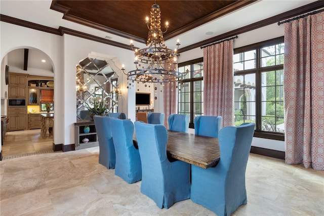 10138 Enchanted Oak Dr, Golden Oak, FL 32836 - dining room featuring a chandelier, arched walkways, wood ceiling, and a raised ceiling