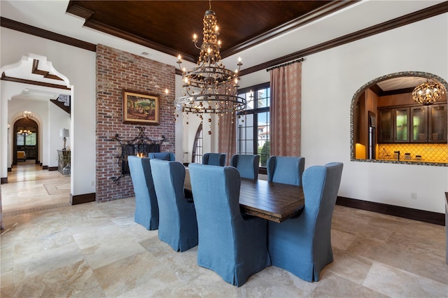 10138 Enchanted Oak Dr, Golden Oak, FL 32836 - dining room featuring a tray ceiling, arched walkways, and a chandelier