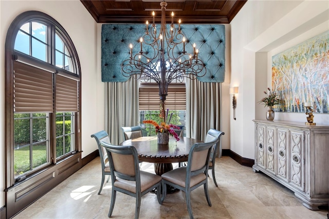 10138 Enchanted Oak Dr, Golden Oak, FL 32836 - dining area featuring an inviting chandelier, a towering ceiling, ornamental molding, coffered ceiling, and baseboards