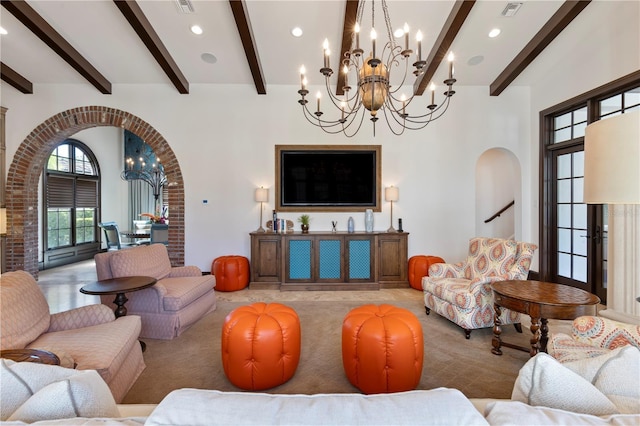 10138 Enchanted Oak Dr, Golden Oak, FL 32836 - living room with a towering ceiling, a notable chandelier, visible vents, beamed ceiling, and arched walkways