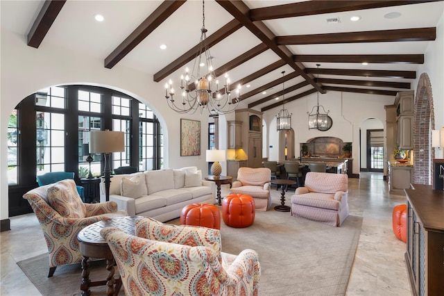 10138 Enchanted Oak Dr, Golden Oak, FL 32836 - living area featuring arched walkways, high vaulted ceiling, a notable chandelier, and visible vents